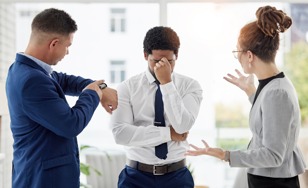 A man under stress in a work environment